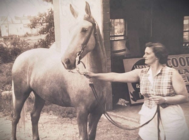 Betty Cooperider, grandmother of Valerie Mockus, leads a horse to the blacksmith shop of Mockus’s great-grandfather, Floyd “Flossy” Cooperider, whose shop was just behind the church that would become Mockus’s home.