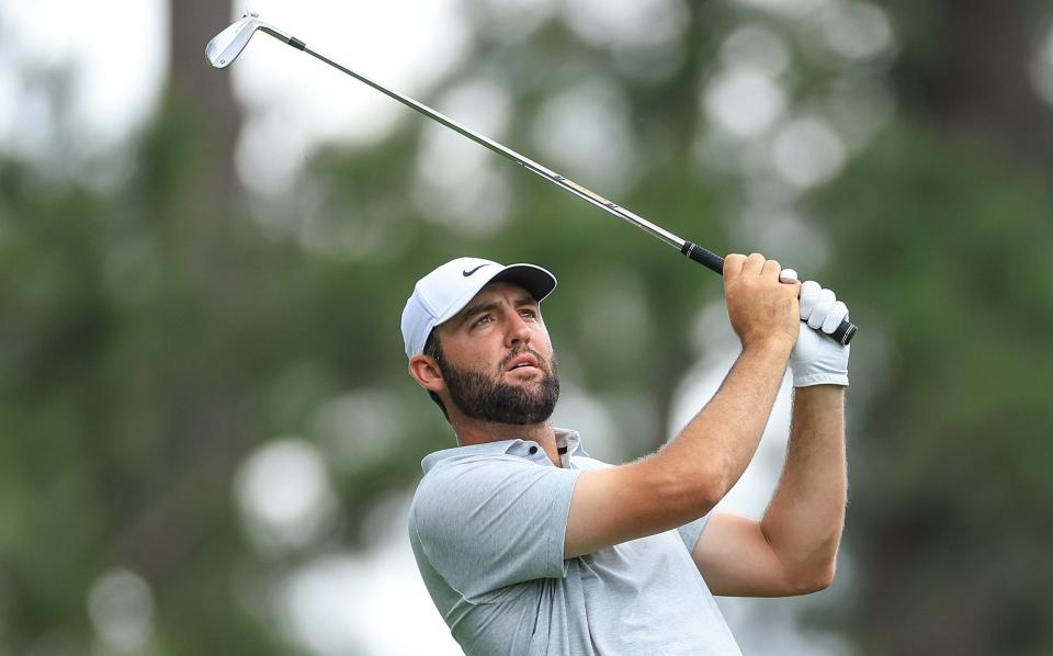 Scottie Scheffler of The United States plays his tee shot on the fourth hole during the first round of the 2024 Masters Tournament