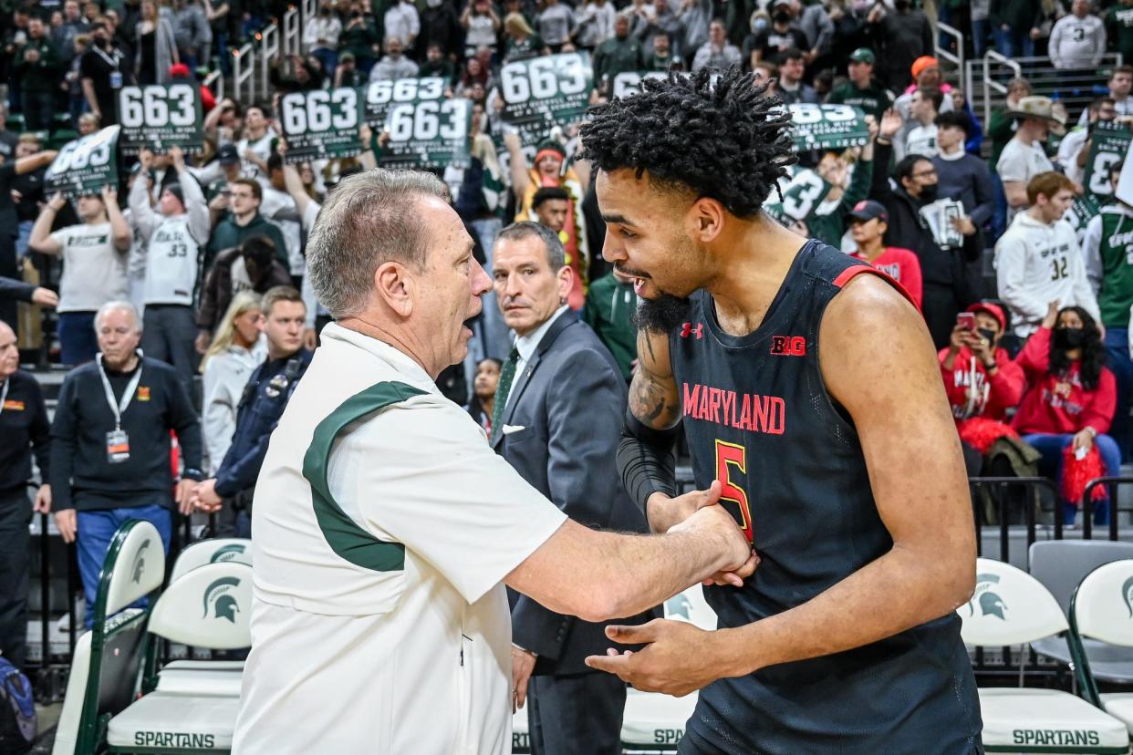 Michigan State's head coach Tom Izzo, left, shakes hands with Maryland's Eric Ayala after the game on Sunday, March 6, 2022, at the Breslin Center.