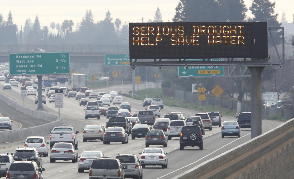 In this photo taken Wednesday, Feb. 12, 2014, a sign on westbound Highway 50, in Sacramento, Calif. used normally to warn drivers of traffic problems or display Amber Alert messages, displays a message to conserve water due to California's drought. Gov. Jerry Brown was governor the last time California had a drought of epic proportions, in 1975-76 and now is pushing a controversial $25 billion plan to build twin tunnels to ship water from the Sacramento-San Joaquin River Delta to farmland and cities further south. (AP Photo/Rich Pedroncelli)