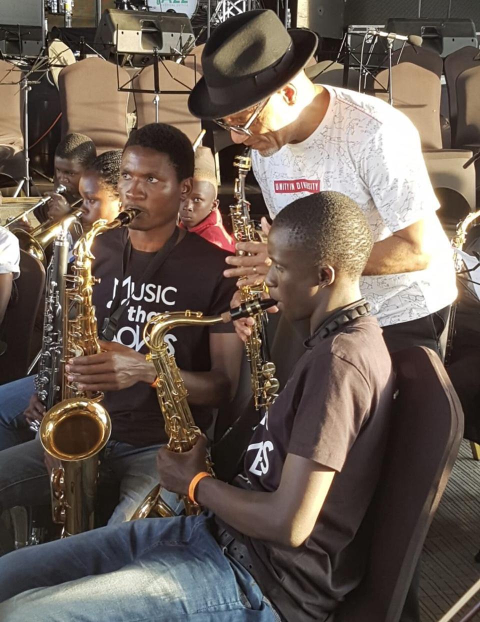 Ghetto Classics, a unique band of musicians born from the slums of Kenya Kirk Whalum with Joseph Omondi