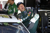 Clint Bowyer gets in his car during practice for a NASCAR Cup Series auto race at Michigan International Speedway in Brooklyn, Mich., Saturday, Aug. 10, 2019. (AP Photo/Paul Sancya)