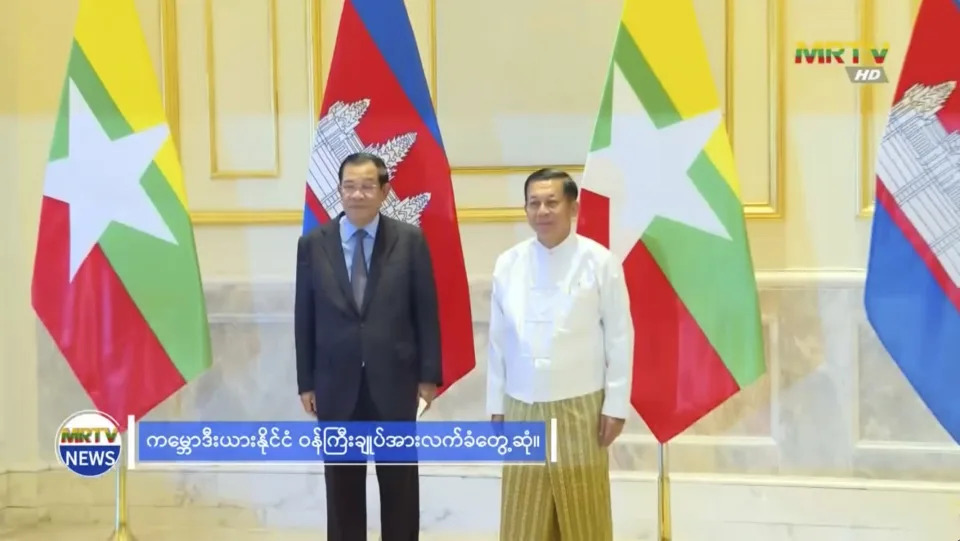 In this image made from video broadcast by Myanmar state broadcaster MRTV, Cambodian Prime Minister Hun Sen and Myanmar State Administration Council Chairman, Senior General Min Aung Hlaing stand together before holding a meeting in Naypyitaw, Myanmar, Friday Jan. 7, 2022. Cambodian Prime Minister Hun Sen’s visit to Myanmar seeking to revive peace efforts after last year's military takeover has provoked an angry backlash among critics, who say he is legitimizing the army’s seizure of power. (MRTV via AP)