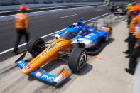 Scott Dixon, of New Zealand, drives out of his pit area during practice for the Indianapolis 500 auto race at Indianapolis Motor Speedway in Indianapolis, Wednesday, May 17, 2023. (AP Photo/Michael Conroy)