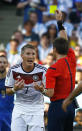 Germany's Bastian Schweinsteiger reacts as he is shown the yellow card by referee Nicola Rizzoli of Italy (R) during the 2014 World Cup final between Germany and Argentina at the Maracana stadium in Rio de Janeiro July 13, 2014. REUTERS/Kai Pfaffenbach (BRAZIL - Tags: SOCCER SPORT WORLD CUP)