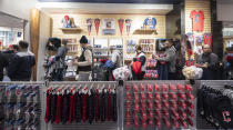 Cleveland Guardians fans wait in line at the opening of the team store in Cleveland, Friday, Nov. 19, 2021. It's Day One for the Guardians, who put caps, jerseys and other merchandise on sale to the public for the first time since dropping the name Indians, the franchise's identity since 1915. (AP Photo/Ken Blaze)