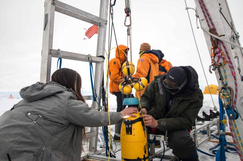 Researchers deploying the Icefin at Thwaites Glacier in January 2020.