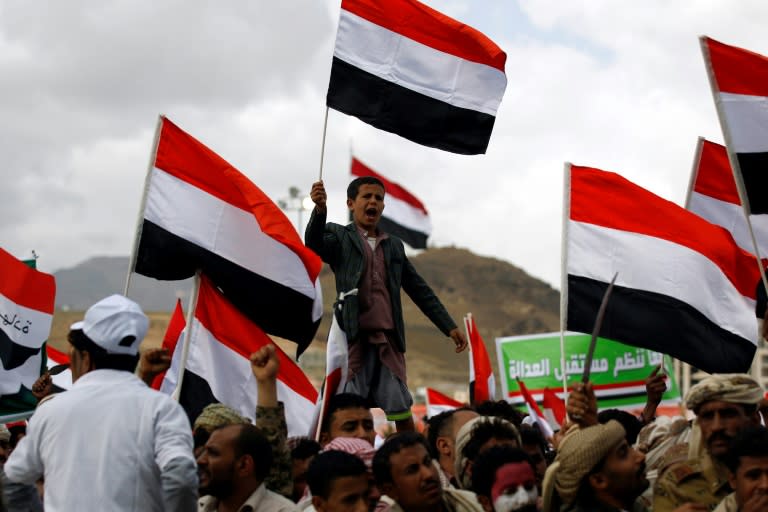 Supporters of Yemen's Huthi rebels and their allies chant slogans during a rally in Sanaa on March 26, 2017