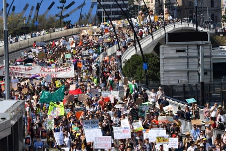 Climate change protesters are seen crossing the Victoria Bridge during the Global Strike 4 Climate rally in Brisbane