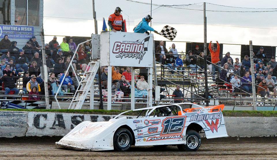 Late model driver Chad Becker of Aberdeen takes the checkered flag during a race last summer at Casino Speedway in Watertown. Becker won the late model points title for the fourth-straight year and also was the national WISSOTTA late model points champion. The 69th season of racing at Casino Speedway is scheduled to open Sunday with a Mother's Day program.