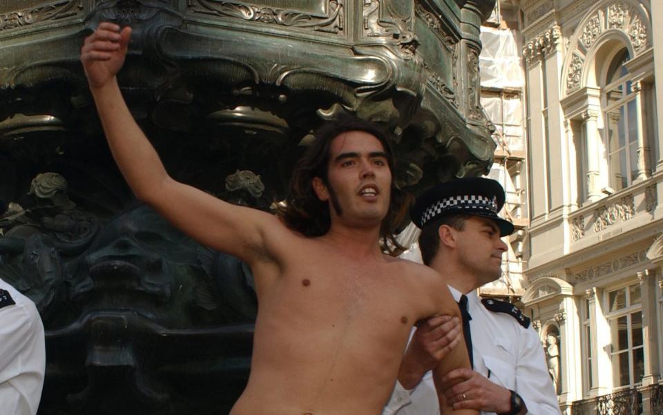 Russell Brand naked and is arrested during the May Day protests in Piccadilly Circus, London, in 2002