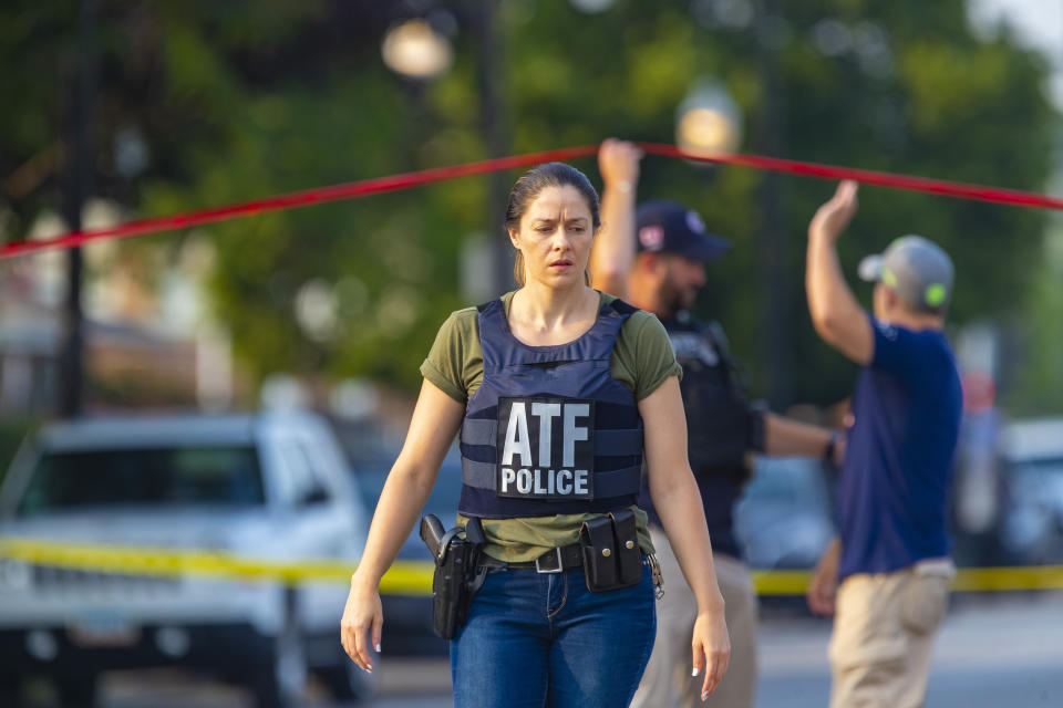ATF agents work the scene of a shooting on South Ashland Avenue near West 118th Street next to Interstate 57, July 7, 2021. Police say three undercover law enforcement officers were shot and wounded while driving onto an expressway on Chicago’s South Side. (Vashon Jordan Jr./Chicago Tribune via AP)
