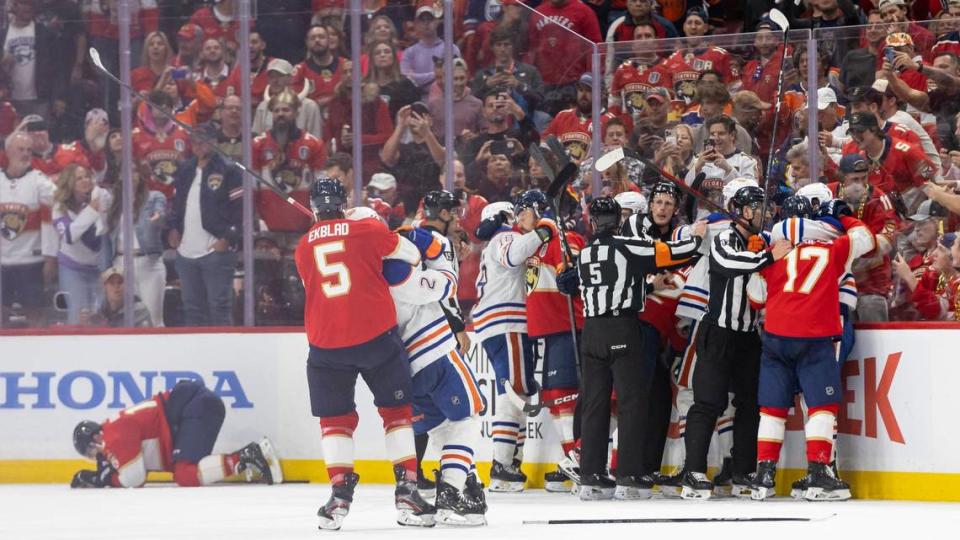 Referees try to break a scrum after Florida Panthers center Aleksander Barkov (16) was hit by Edmonton Oilers center Leon Draisaitl (29) in the third period of Game 2 of the NHL Stanley Cup Final at the Amerant Bank Arena on Monday, June 10, 2024, in Sunrise, Fla.