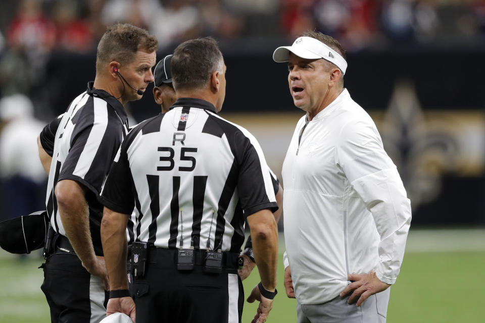 FILE - In this Monday, Sept. 9, 2019, file photo, New Orleans Saints head coach Sean Payton talks to league referees before an NFL football game against the Houston Texans, in New Orleans. The New Orleans Saints visit Los Angeles for a rematch of the NFC championship game won by the Rams, but remembered for the no-call that created the opening for Sean McVay's team to storm through. (AP Photo/Bill Feig, File)