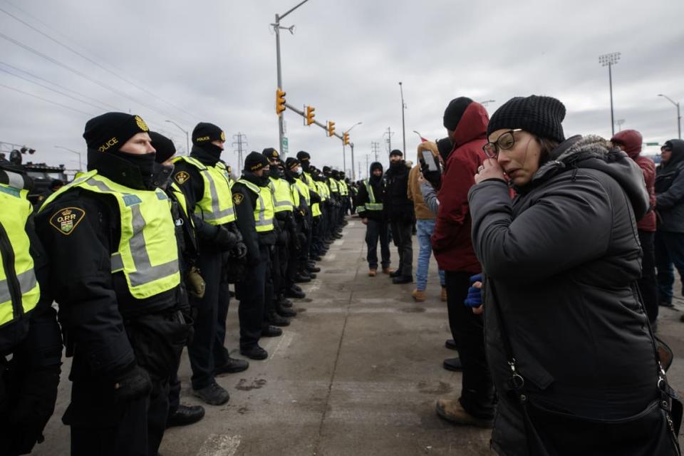 <div class="inline-image__caption"><p>Canadian police and protestors stood off at the Ambassador Bridge Saturday, though the demonstrators initially began to disperse just before noon.</p></div> <div class="inline-image__credit">Cole Burston/Getty</div>