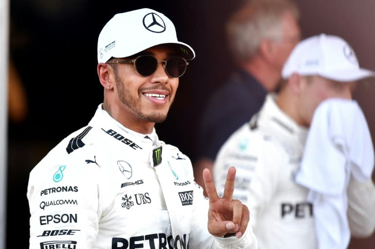 Mercedes' British driver Lewis Hamilton celebrates after the qualifying session for the Formula One Azerbaijan Grand Prix at the Baku City Circuit in Baku on June 24, 2017