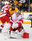 NASHVILLE, TN - APRIL 20: Goalie Jimmy Howard #35 of the Detroit Red Wings takes a puck off the shoulder in Game Five of the Western Conference Quarterfinals against the Nashville Predators during the 2012 NHL Stanley Cup Playoffs at the Bridgestone Arena on April 20, 2012 in Nashville, Tennessee. (Photo by Frederick Breedon/Getty Images)