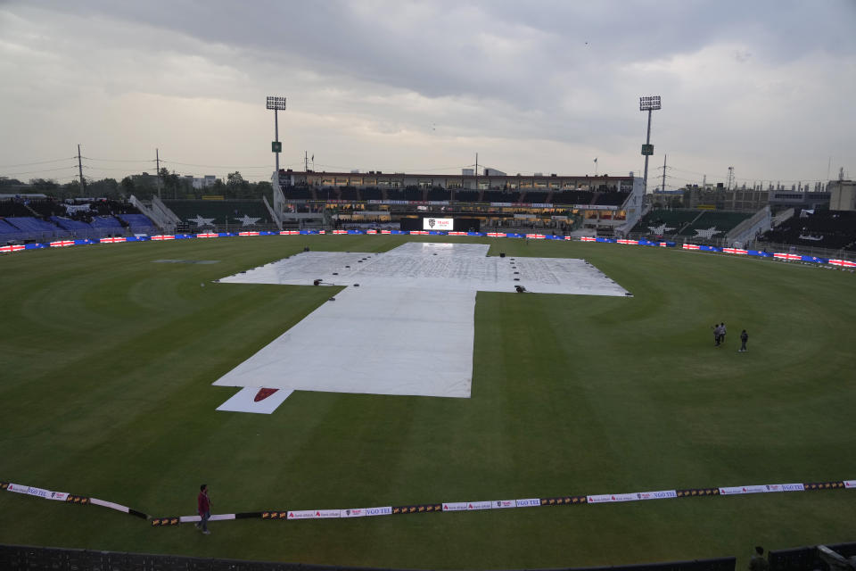 Pitch covers with sheets during rain, which delay the start of first T20 cricket match between Pakistan and New Zealand, in Rawalpindi, Pakistan, Thursday, April 18, 2024. (AP Photo/Anjum Naveed)