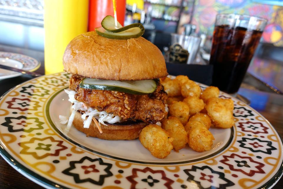 Hot chicken sandwich with buttermilk battered chicken breast, spicy oil, bread and butter pickles, coleslaw and brioche bun at State 48 Brewery in Phoenix.