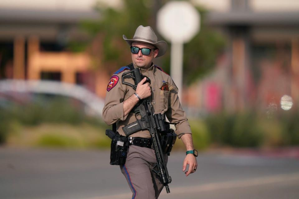 Police officer on the scene of the mall shooting (Copyright 2023 The Associated Press. All rights reserved.)