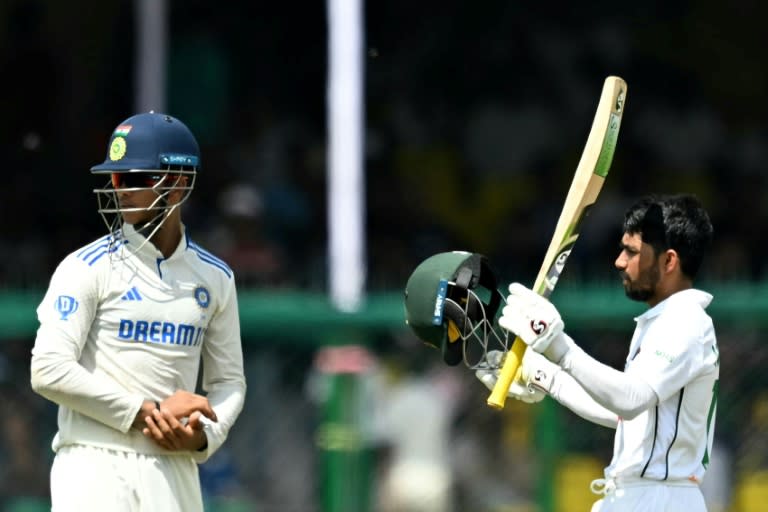 Bangladesh's Mominul Haque celebrates his century against India in Kanpur (Money SHARMA)