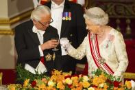 President of Singapore Tony Tan Keng Yam and Queen Elizabeth share a toast during a state banquet at Buckingham Palace in central London, on day one of the President of Singapore's state visit to Britain October 21, 2014. The President of Singapore Tony Tan and his wife Mary Chee started a four day state visit to Britain on Tuesday. REUTERS/Dominic Lipinski/Pool (BRITAIN - Tags: ROYALS ENTERTAINMENT TPX IMAGES OF THE DAY)