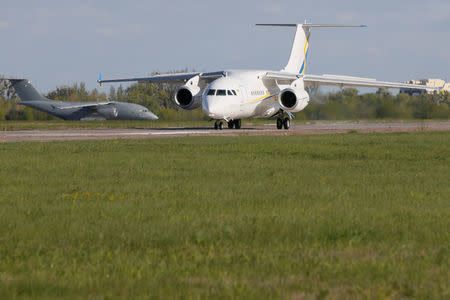 FILE PHOTO - An Antonov An-158 (front) passenger plane and an Antonov An-178 cargo plane are seen at the airfield of the Antonov aircraft plant in the settlement of Hostomel, Ukraine April 27, 2016. REUTERS/Valentyn Ogirenko