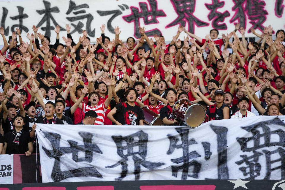 Urawa Reds' fans cheer for their team prior to the Soccer Club World Cup second round soccer match between Club Leon and Urawa Reds at Prince Abdullah Al-Faisal Stadium in Jeddah, Saudi Arabia, Friday, Dec. 15, 2023. (AP Photo/Manu Fernandez)