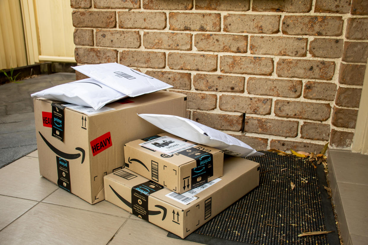 Sydney, Australia - 2020-10-17 Amazon prime boxes and envelopes delivered to a front door of residential building.