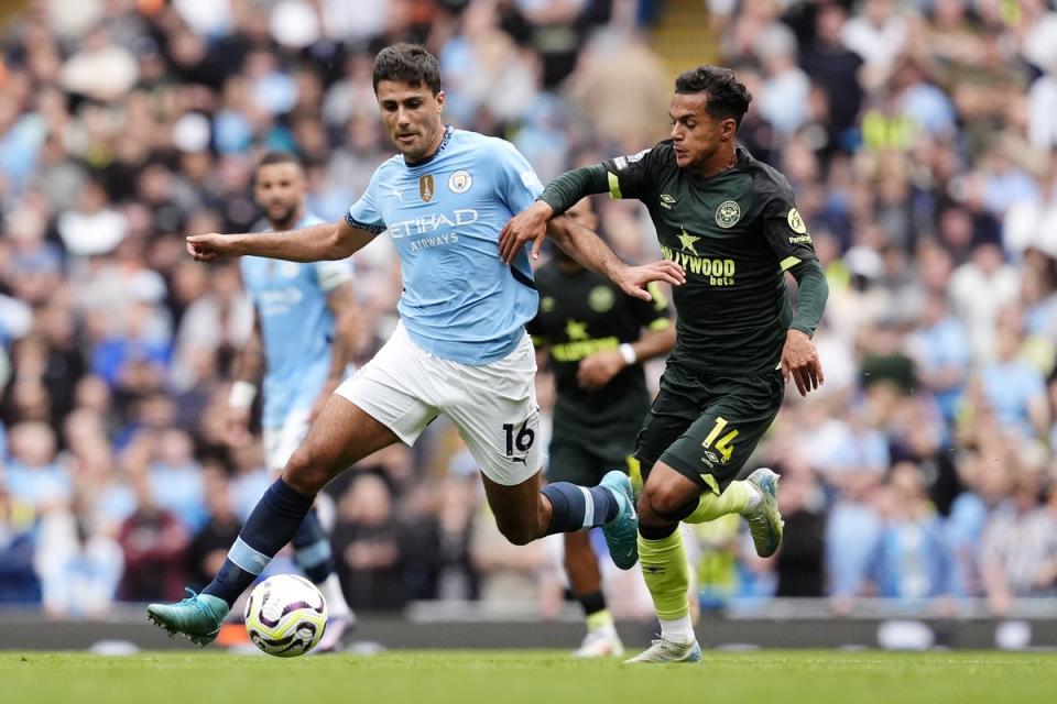 Rodri (left) and Brentford’s Fabio Carvalho battle for the ball during Manchester City’s 2-1 win  (Nick Potts/PA)