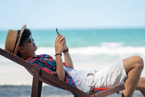 <span class="caption">That two-week beach vacation you've been dreaming of could have long-term effects on your health. </span> <span class="attribution"><a class="link " href="https://www.shutterstock.com/image-photo/young-asian-adult-men-traveler-casual-1428130970?src=3LXUOFrilv26pLU_zD1g8w-1-1" rel="nofollow noopener" target="_blank" data-ylk="slk:PVStudio/ Shutterstock;elm:context_link;itc:0;sec:content-canvas">PVStudio/ Shutterstock</a></span>