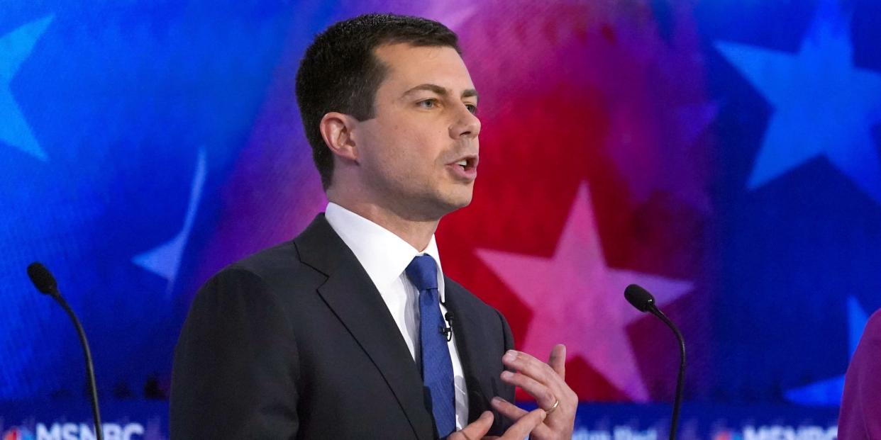 FILE PHOTO: Democratic presidential candidate South Bend Mayor Pete Buttigieg points to his wedding ring from his marriage to his husband Chasten as he talks about civil rights in the United States during the U.S. Democratic presidential candidates debate at the Tyler Perry Studios in Atlanta, Georgia, U.S. November 20, 2019. REUTERS/Brendan Mcdermid/File Photo