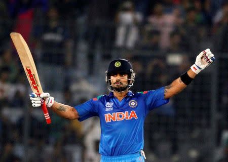 India's Virat Kohli celebrates after India won the semi final match against South Africa in the ICC Twenty20 World Cup at the Sher-E-Bangla National Cricket Stadium in Dhaka April 4, 2014. REUTERS/Andrew Biraj