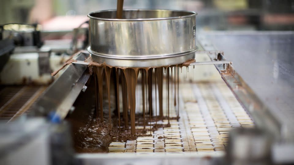 Chocolate is poured on wafer bars at a Kit Kat factory in Japan. - Behrouz Mehri/AFP/Getty Images