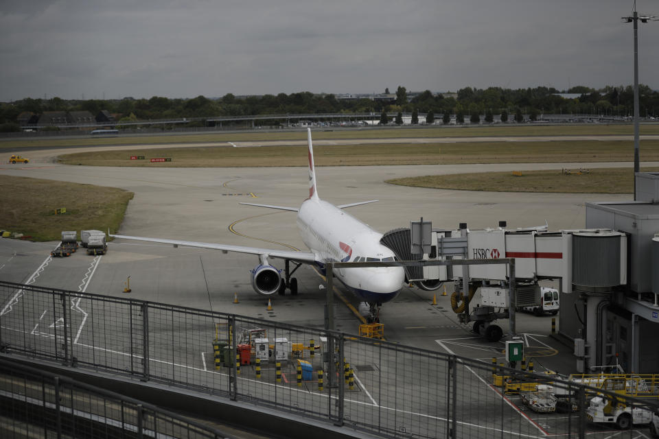 A British Airways plane sits parked at Heathrow Airport in London, Monday, Sept. 9, 2019. British Airways says it has had to cancel almost all flights as a result of a pilots' 48-hour strike over pay. (AP Photo/Matt Dunham)