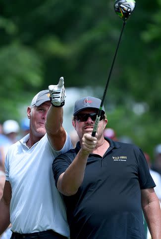 <p>Steve Dykes/Getty Images</p> Brett Favre and Toby Keith at the American Family Insurance Championship on June 22, 2019 in Madison, Wisconsin