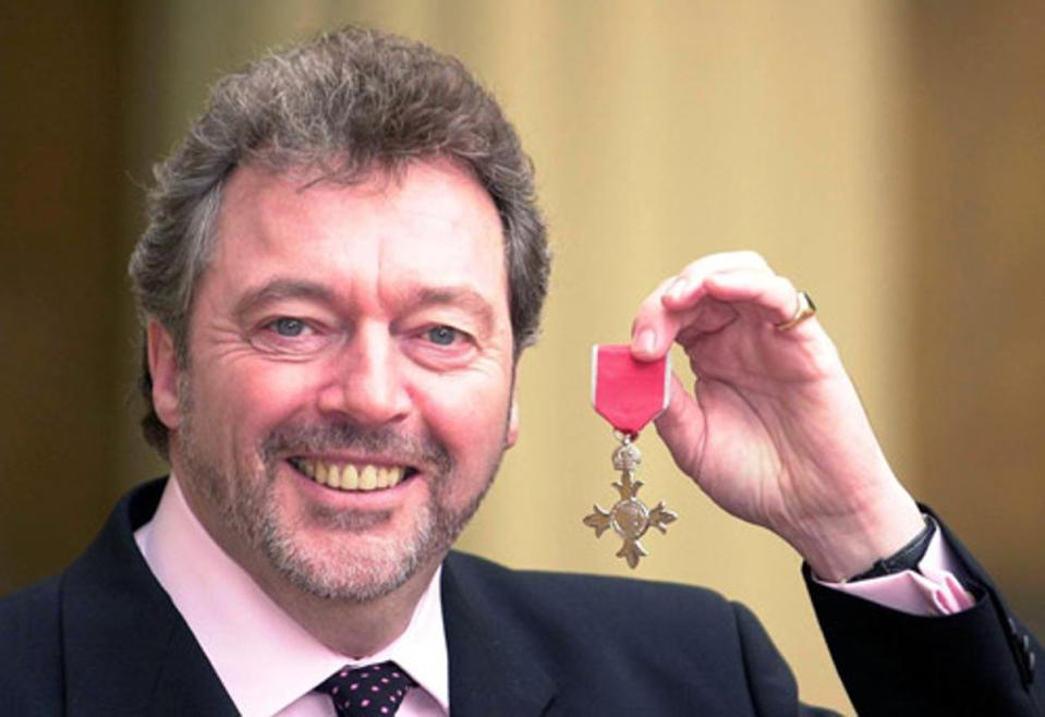 Jeremy Beadle receives his OBE in 2001 (PA)