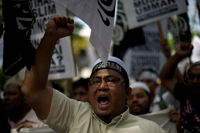 A Malaysian Muslim activist shouts slogans during a peaceful protest against the persecution of Rohingya Muslims in Myanmar, outside the Myanmar embassy in Kuala Lumpur, on February 14, 2014