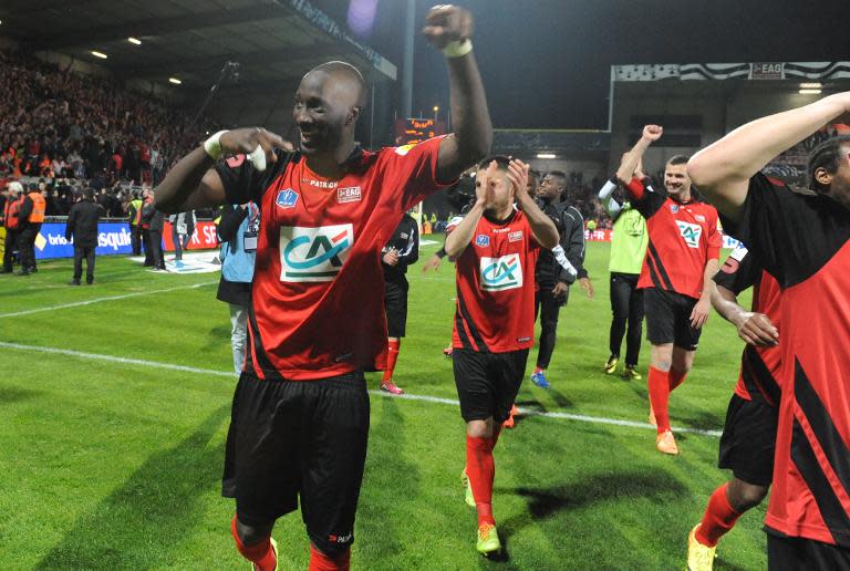 Guingamp's players celebrate winning the French Cup football match Guingamp against Monaco on April 16, 2014 at the Roudourou stadium in Guingamp, western of France