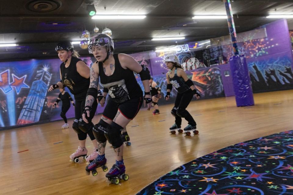 Members of the Long Island Roller Rebels practice at United Skates of America in Seaford, NY on March 19, 2024. AP