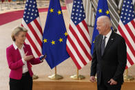 European Commission President Ursula von der Leyen, left, speaks witih U.S. President Joe Biden during arrival for the EU-US summit at the European Council building in Brussels, Tuesday, June 15, 2021. (AP Photo/Francisco Seco)