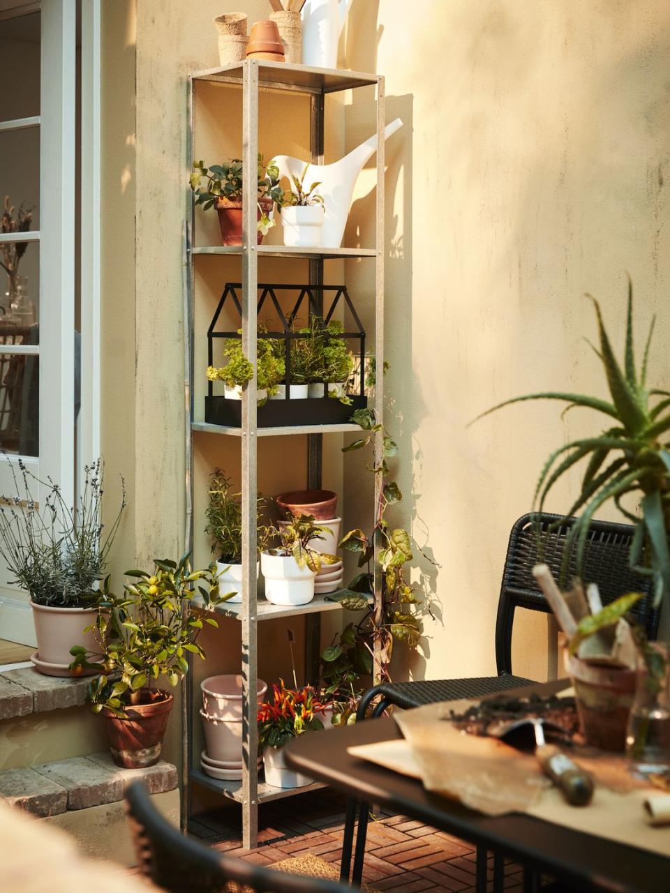 <p><a href="https://www.housebeautiful.com/uk/garden/designs/how-to/a781/balcony-garden-guide/" rel="nofollow noopener" target="_blank" data-ylk="slk:Balcony gardens;elm:context_link;itc:0;sec:content-canvas" class="link ">Balcony gardens</a> were all the rage on Instagram last year, with more households transforming small spaces into urban jungles. </p><p>'Limited space shouldn't be a hinderance when creating your personal oasis, playing with storage solutions with different heights will help maximise what you have available. </p><p>'For example, the HYLLIS shelving unit is sturdy and lightweight. Simply stack pots of different sizes and fill them with your favourite herbs, flowers and plants to create a lush, zen spot.'</p>