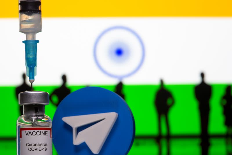 A 3D-printed Telegram app logo, small toy figurines, a syringe and vial labelled "coronavirus disease (COVID-19) vaccine" are seen in front of India flag in this illustration
