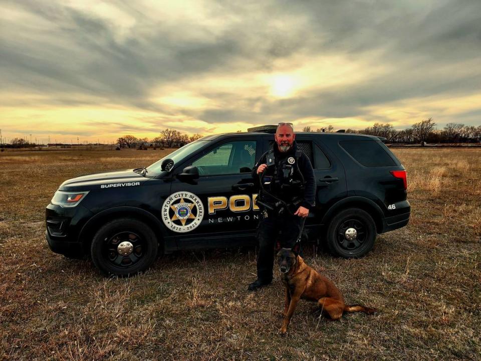Newton police officer Tony Hawpe and his K-9 partner, Bella, pose for a photo. Bella had to be put down in June after a medical emergency.