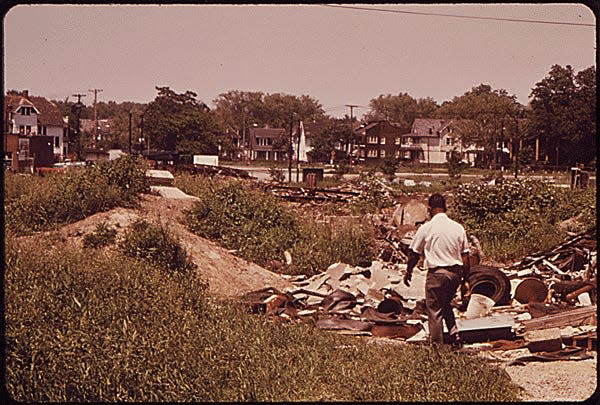 EMPTY LOT IN CLEVELAND INNER CITY, ON SUPERIOR AVENUE, BECOMES A DUMPING GROUND