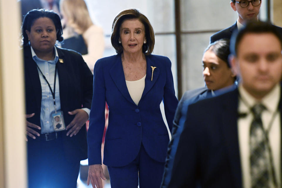 House Speaker Nancy Pelosi of Calif., arrives on Capitol Hill in Washington, Friday, March 27, 2020. (AP Photo/Susan Walsh)