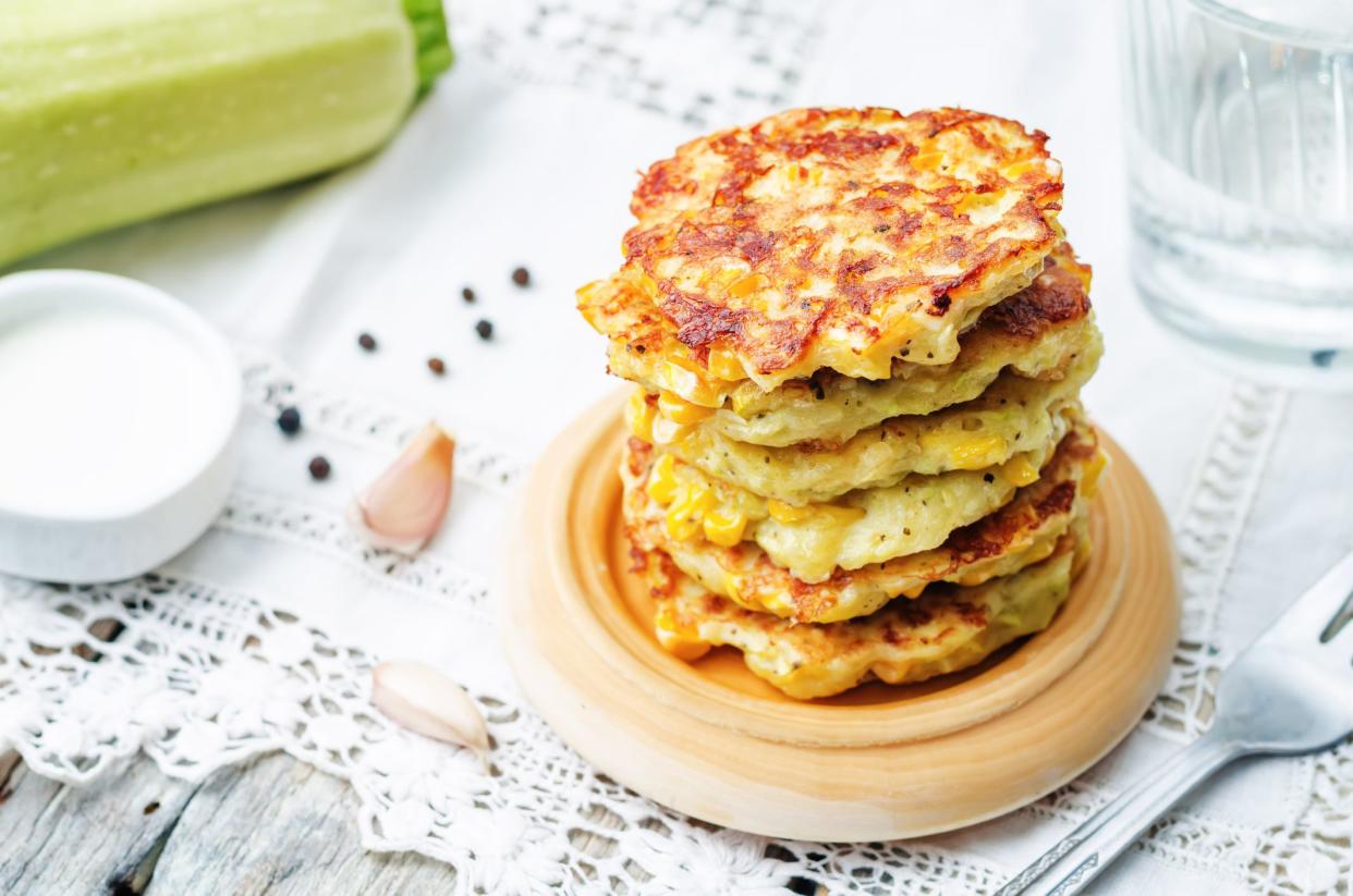 zucchini corn fritters on a white background. the toning. selective focus