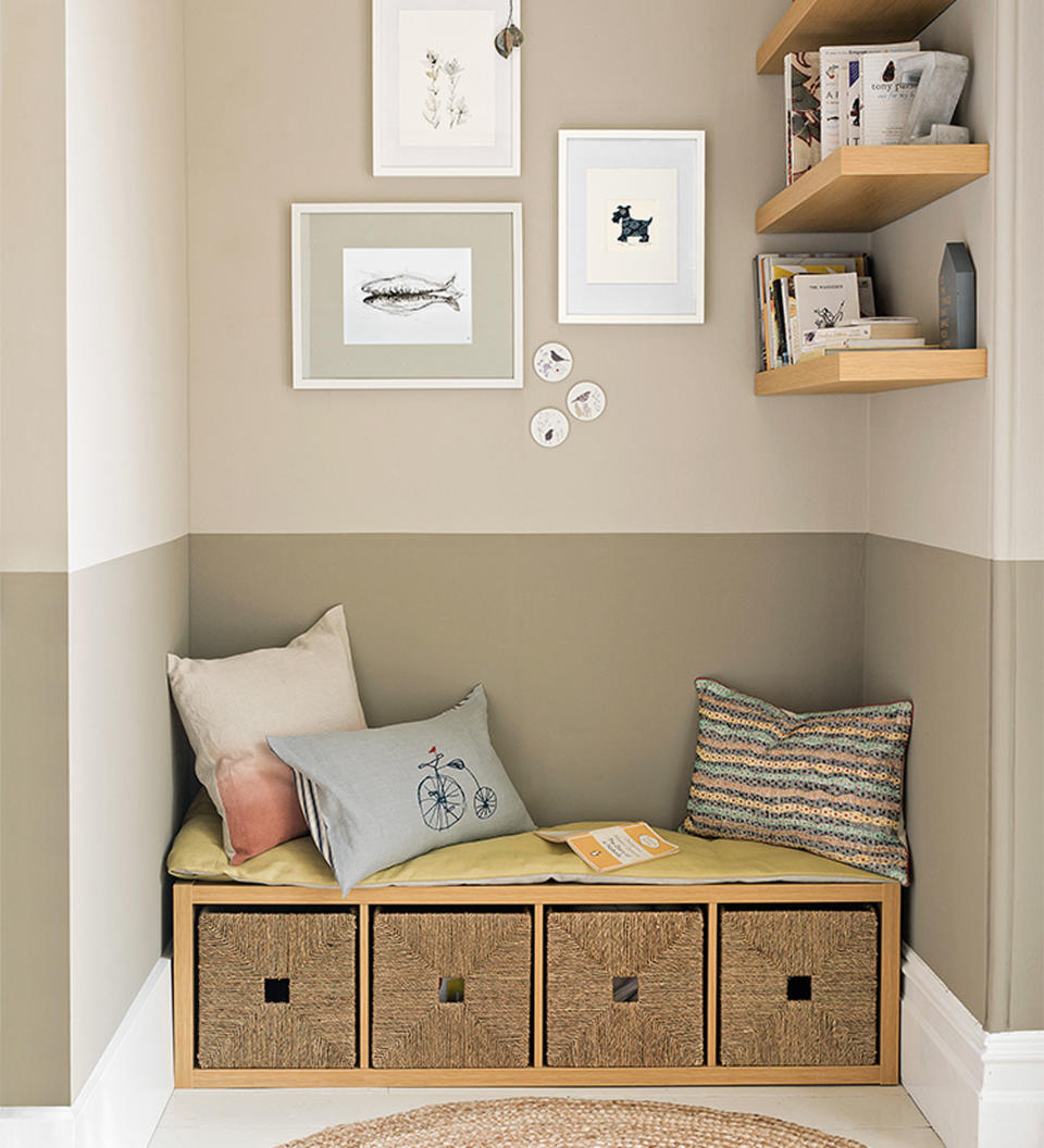 beige living room with half painted walls and bench seat