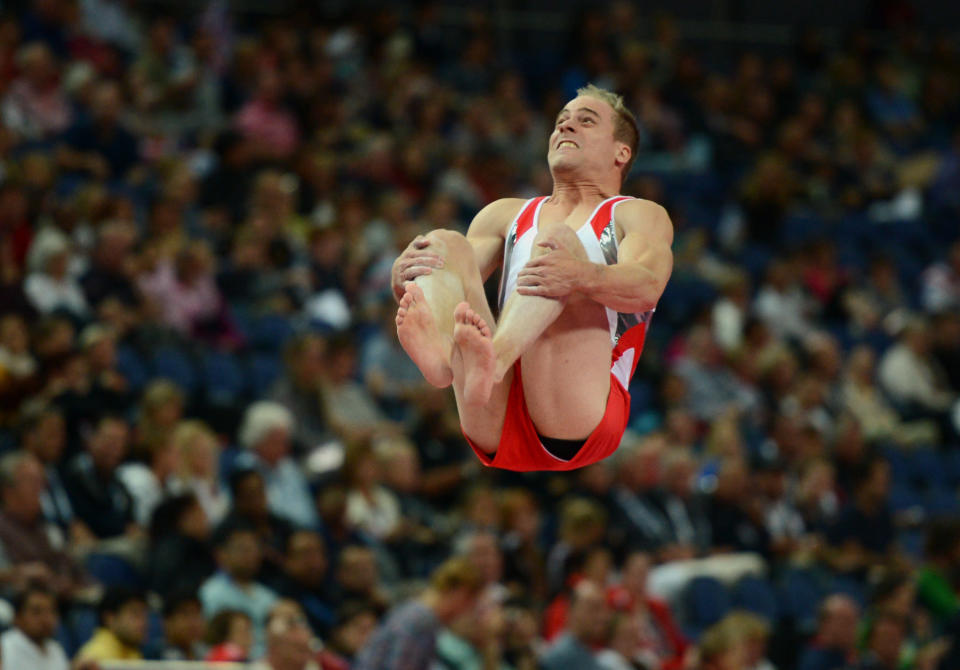 Switzerland's Claudio Capelli competes on the vault during the Artistic Gymnastics team qualification at the North Greenwich Arena, London, on day one of the London 2012 Olympics. . 