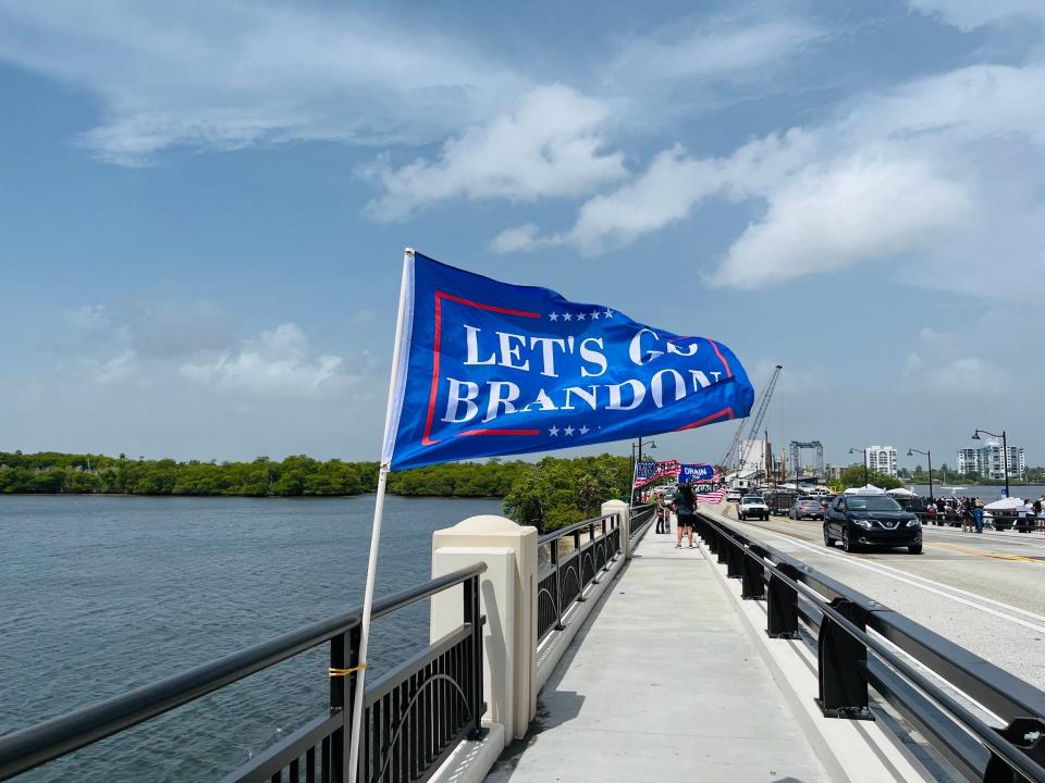 Trump supporters posted flags on the bridge outside of Mar-a-Lago.